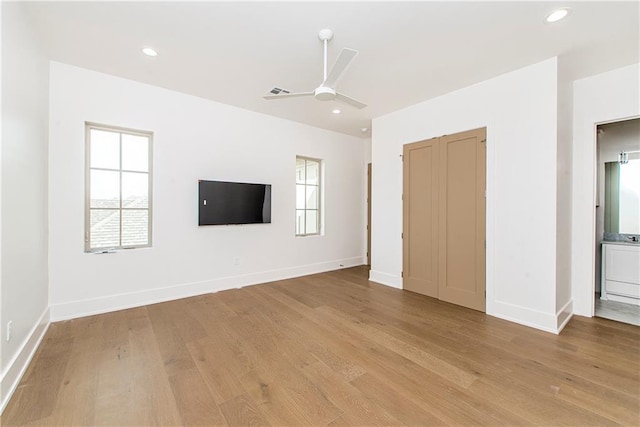 unfurnished living room featuring light wood-style flooring, recessed lighting, visible vents, and baseboards