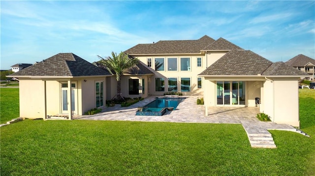 rear view of house with an outdoor pool, a patio area, a lawn, and stucco siding