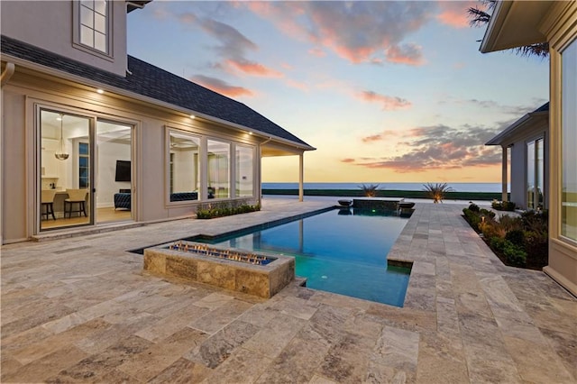 view of swimming pool featuring a patio and a pool with connected hot tub