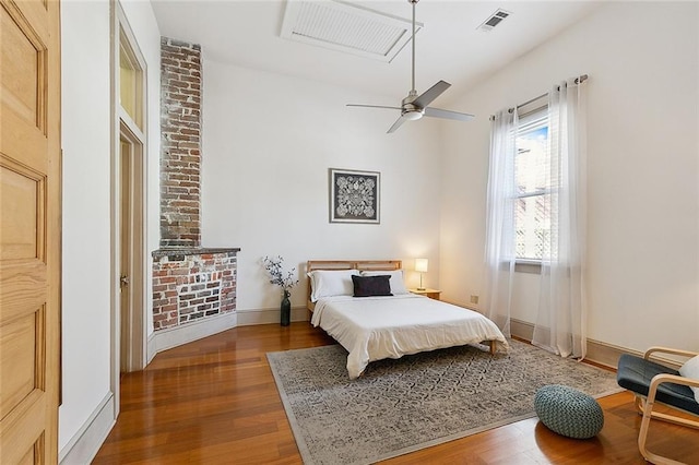 bedroom featuring a ceiling fan, baseboards, visible vents, and dark wood-type flooring
