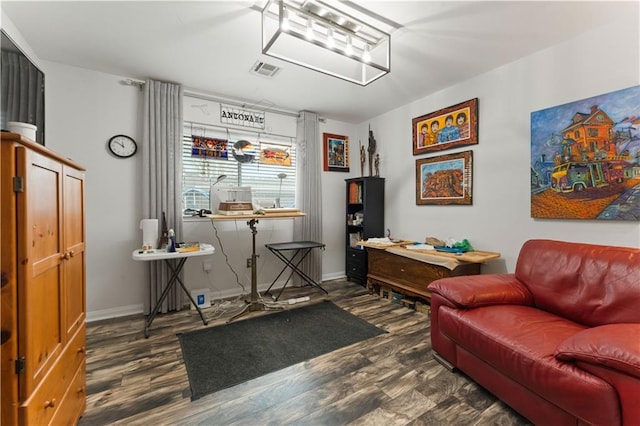 interior space with visible vents, baseboards, and wood finished floors