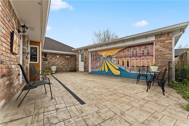 view of patio / terrace featuring fence