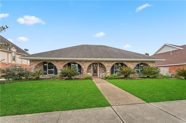 25 Yosemite Dr, New Orleans, LA 70131 - view of front facade featuring a front lawn, brick siding, and roof with shingles