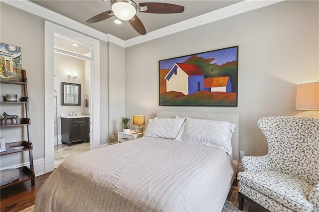 bedroom with a ceiling fan, wood finished floors, connected bathroom, crown molding, and baseboards