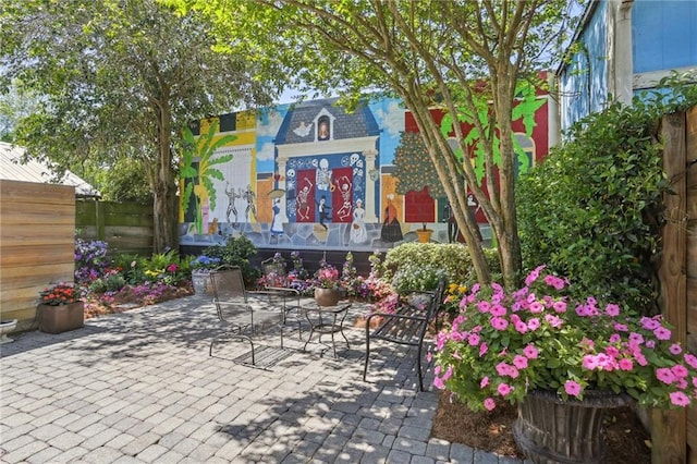 view of patio / terrace featuring fence