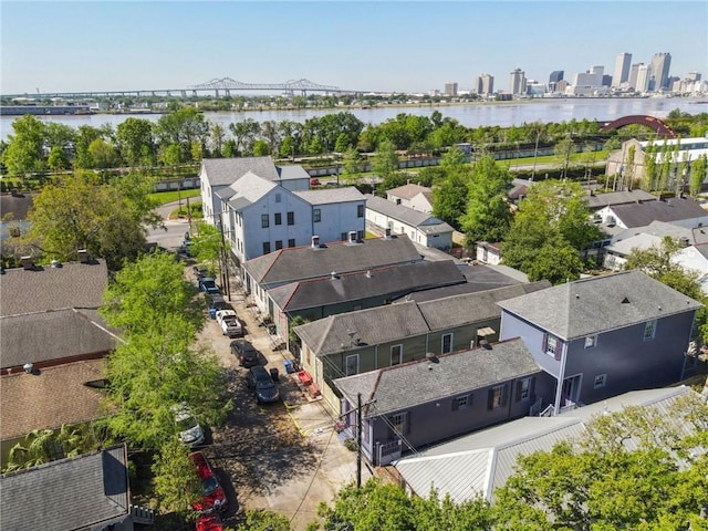 birds eye view of property with a city view and a water view