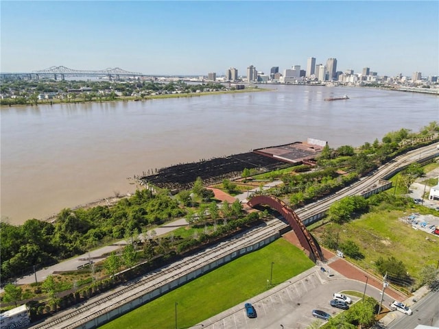 birds eye view of property featuring a water view and a city view