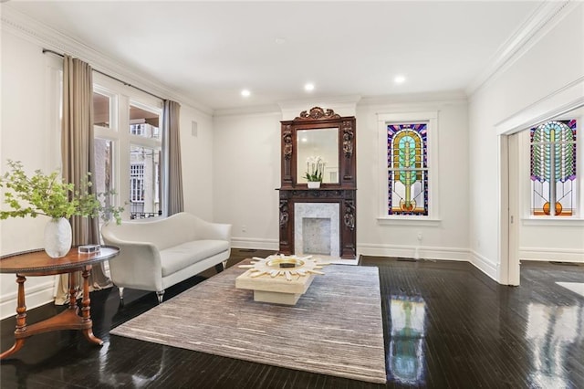 living room with a premium fireplace, dark wood-style flooring, baseboards, and ornamental molding