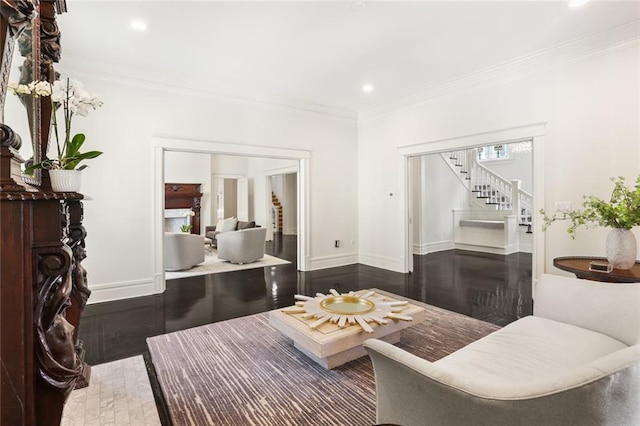 living area featuring stairway, wood finished floors, baseboards, recessed lighting, and ornamental molding