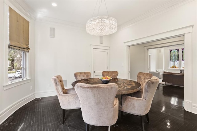 dining space with a notable chandelier, dark wood-style flooring, baseboards, and ornamental molding