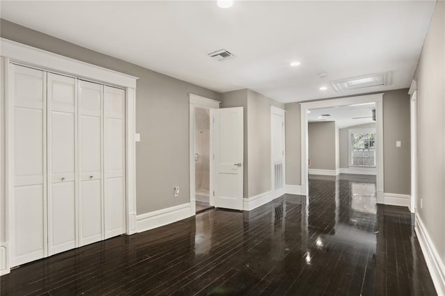 interior space with visible vents, wood finished floors, recessed lighting, a closet, and baseboards