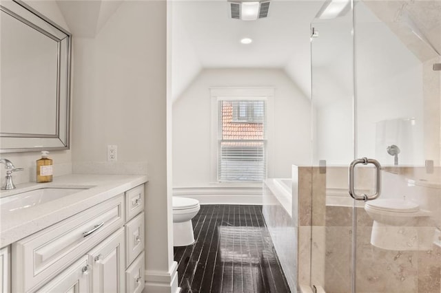 full bath with visible vents, a shower stall, toilet, vaulted ceiling, and vanity