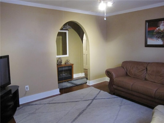 314 Halsey Dr, Harahan, LA 70123 - living area with arched walkways, baseboards, wood finished floors, ceiling fan, and crown molding