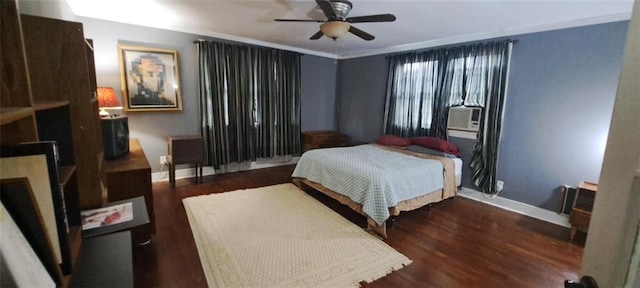 bedroom featuring wood finished floors, cooling unit, crown molding, baseboards, and ceiling fan