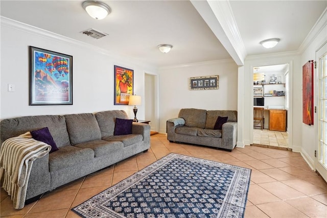 living area with light tile patterned flooring, visible vents, and ornamental molding