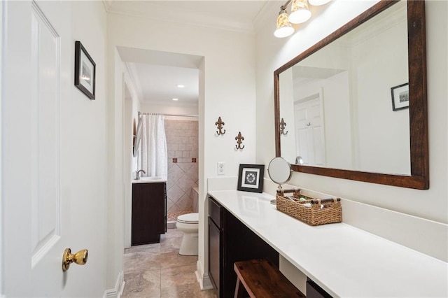 bathroom with tiled shower, toilet, vanity, and ornamental molding