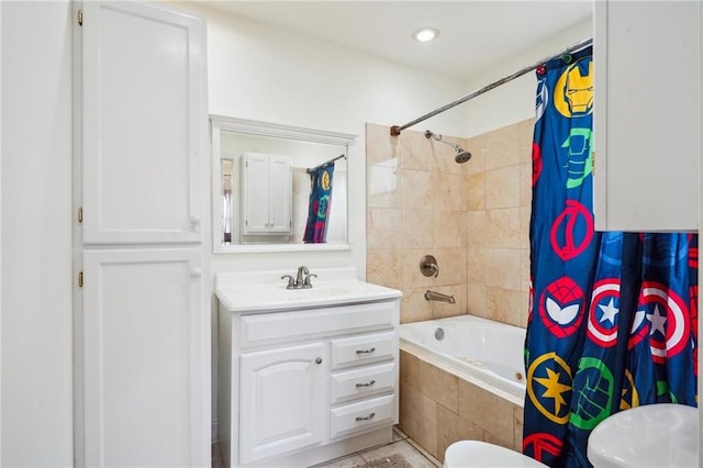 full bathroom featuring vanity, toilet, tiled shower / bath, and recessed lighting