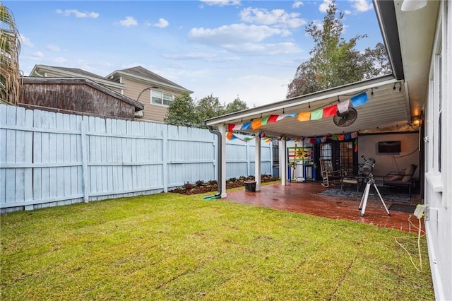 view of yard featuring a patio and fence