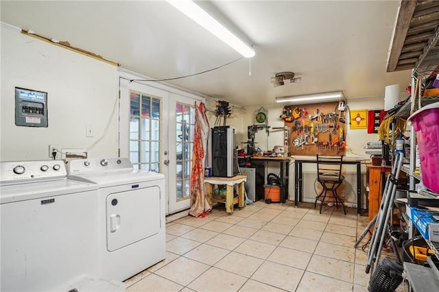 laundry area featuring laundry area, light tile patterned flooring, french doors, and washing machine and clothes dryer