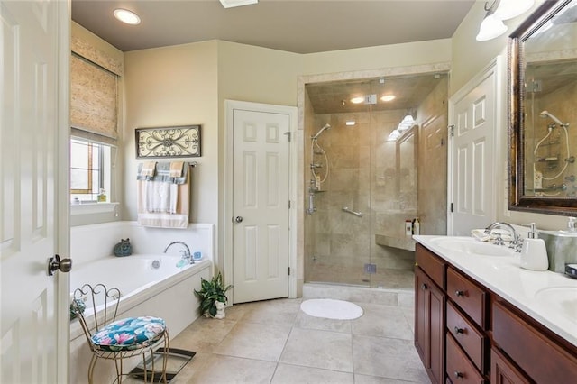 full bathroom featuring tile patterned flooring, a shower stall, double vanity, a bath, and a sink