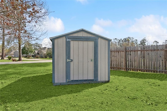 view of shed with fence