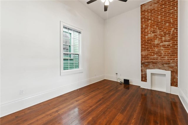 unfurnished living room featuring baseboards, a ceiling fan, and hardwood / wood-style flooring