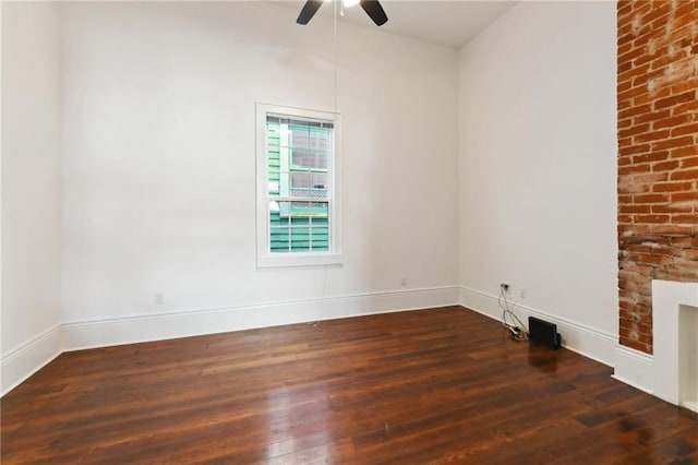 empty room featuring ceiling fan and wood finished floors