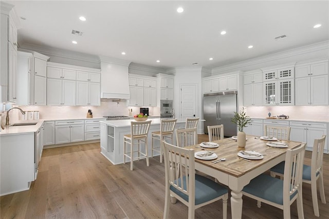 11 Khan Ct, Metairie, LA 70003 - dining room with crown molding, light wood-type flooring, and recessed lighting
