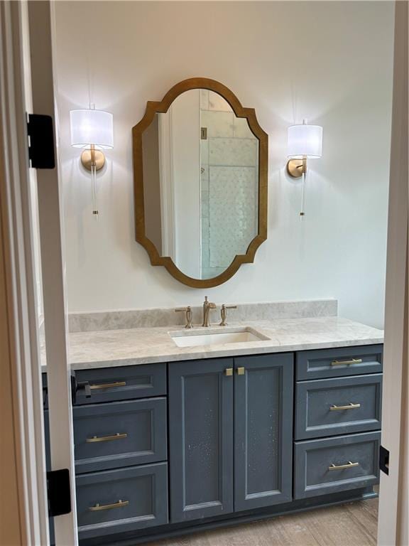 bathroom featuring vanity and a shower