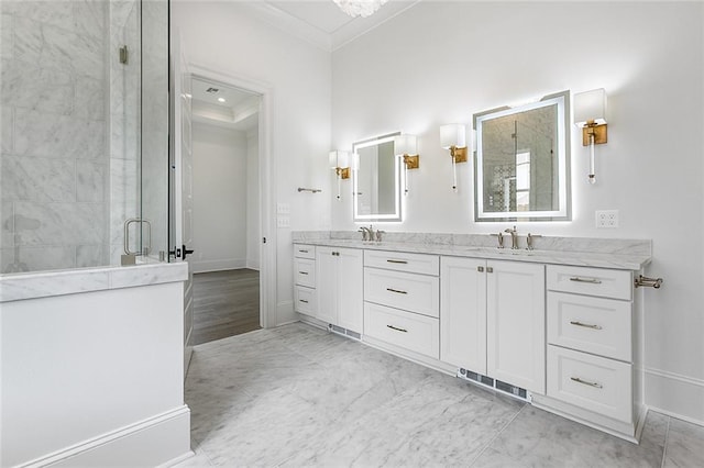 11 Khan Ct, Metairie, LA 70003 - bathroom with crown molding, double vanity, a stall shower, and baseboards