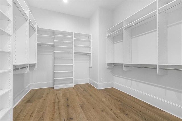 11 Khan Ct, Metairie, LA 70003 - walk in closet featuring wood finished floors