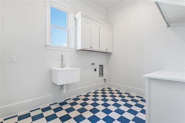 11 Khan Ct, Metairie, LA 70003 - laundry area with washer hookup, cabinet space, tile patterned floors, hookup for an electric dryer, and baseboards