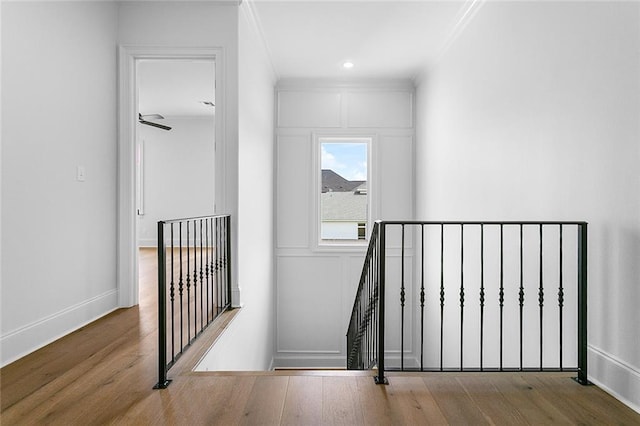 11 Khan Ct, Metairie, LA 70003 - stairs with wood finished floors, ornamental molding, baseboards, and ceiling fan
