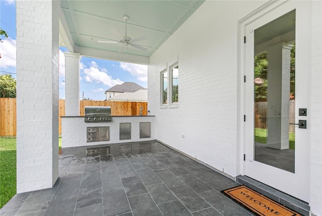 11 Khan Ct, Metairie, LA 70003 - fenced backyard with ceiling fan and a patio