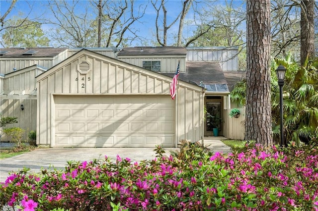 exterior space featuring an attached garage and driveway