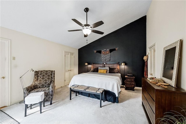 bedroom with light carpet, a ceiling fan, and lofted ceiling