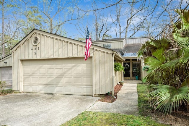 view of front of home featuring board and batten siding and a garage