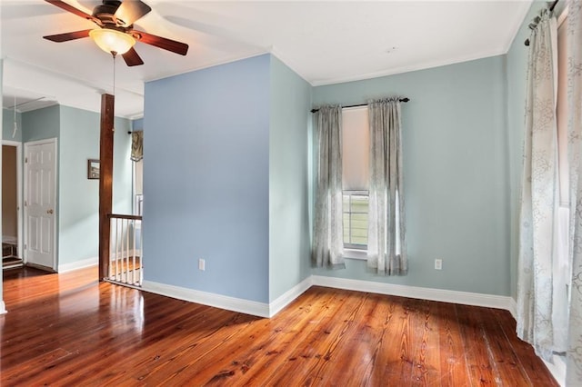 empty room featuring baseboards, ceiling fan, and wood-type flooring