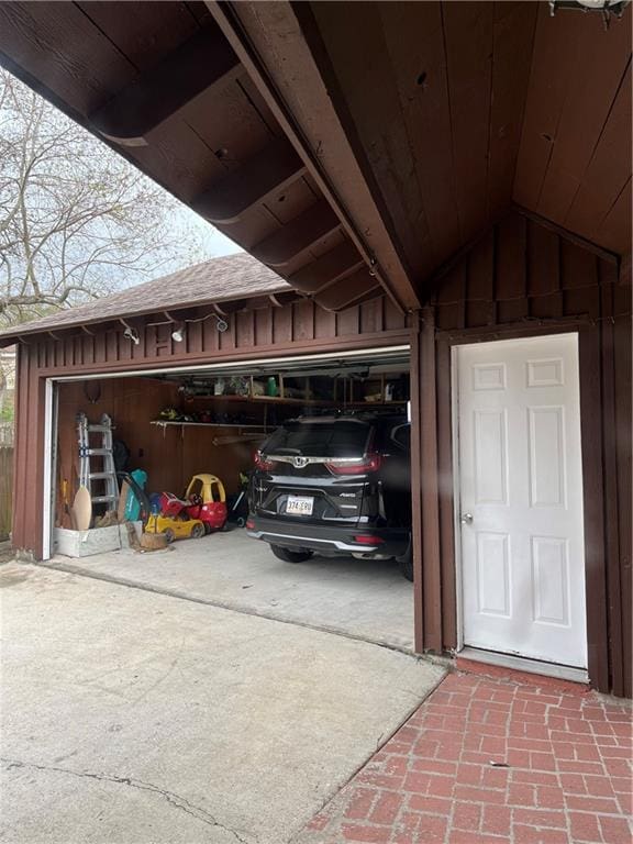 garage with concrete driveway