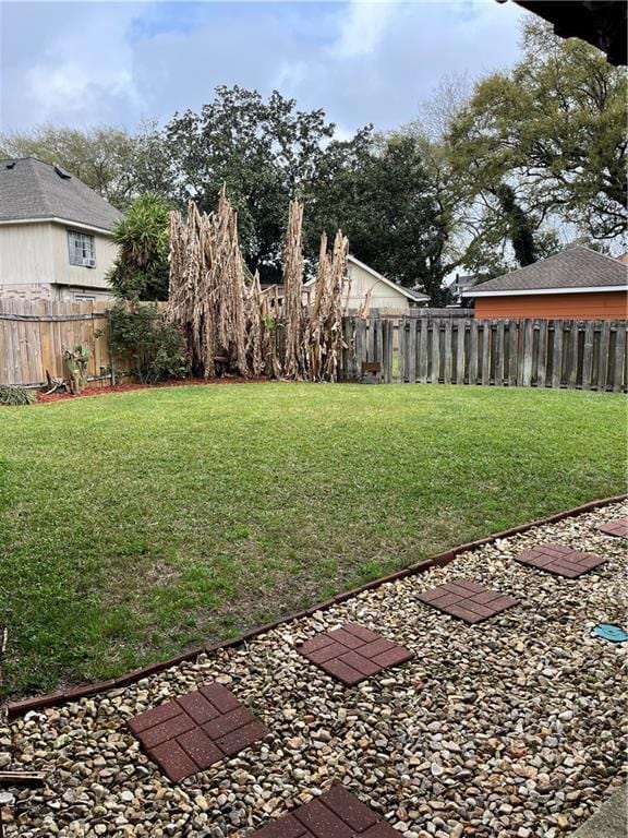 view of yard with a fenced backyard