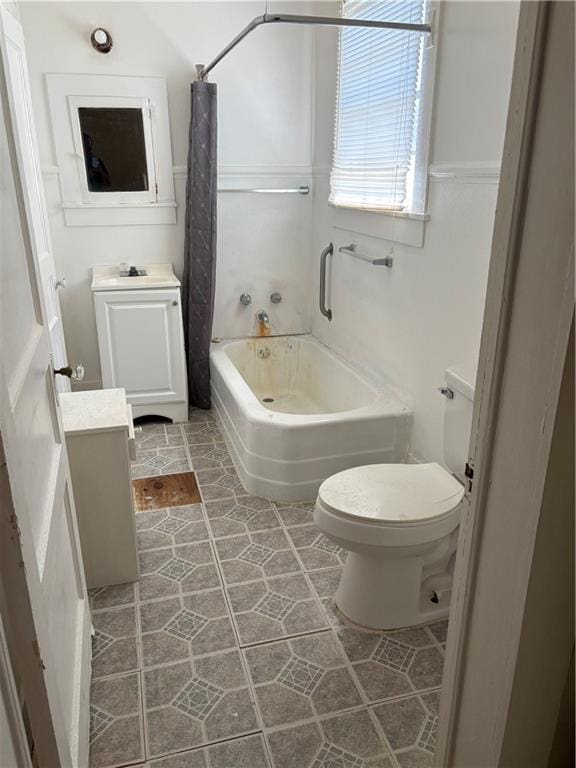 full bathroom featuring tile patterned flooring, vanity, shower / tub combo, and toilet