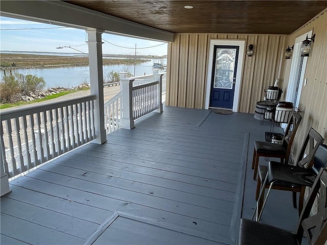 wooden deck with a water view