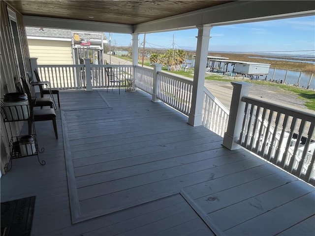 deck featuring a water view