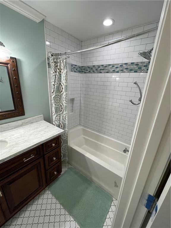 full bath with shower / bath combination with curtain and vanity