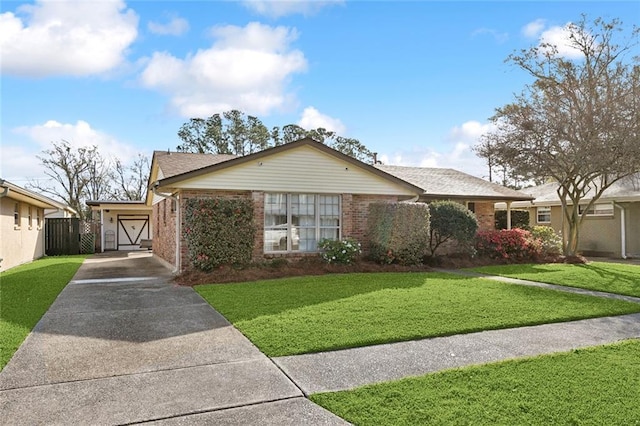 single story home with brick siding, concrete driveway, and a front lawn