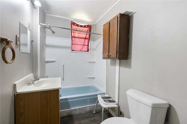 bathroom with shower / bathing tub combination, toilet, wood finished floors, and vanity