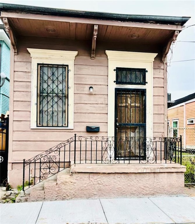 doorway to property with fence