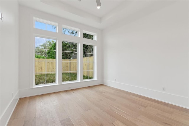 315 Sena Dr, Metairie, LA 70005 - spare room with a raised ceiling, baseboards, and light wood-type flooring