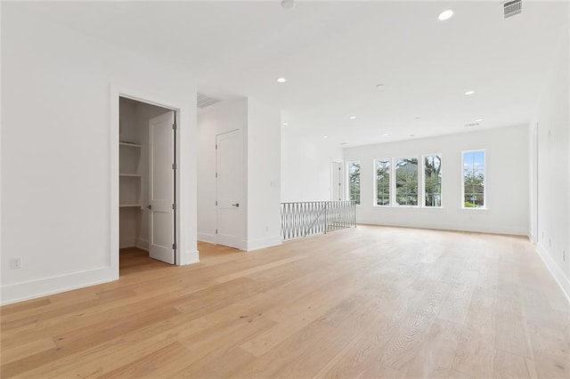 315 Sena Dr, Metairie, LA 70005 - empty room with baseboards, visible vents, light wood-style flooring, and recessed lighting