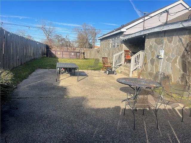 view of patio / terrace with outdoor dining area and a fenced backyard